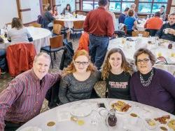 A family posing at the Homecoming Family Breakfast.